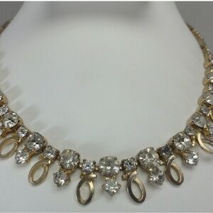 This is a vintage Emmons mid-century gold tone necklace with clear crystals